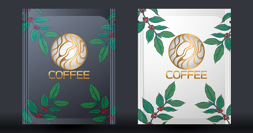 To kaffeposer med emballasje i rolige farger – en mørkeblå og en hvit – og fine illustrasjoner av blader.
